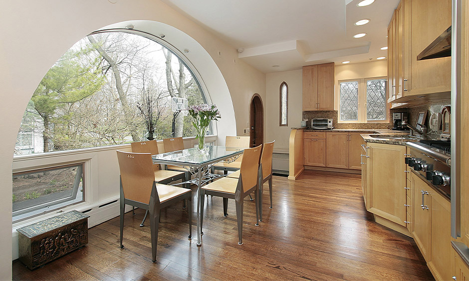 Wooden arch window design in an open modular kitchen creates a stunning visual impact