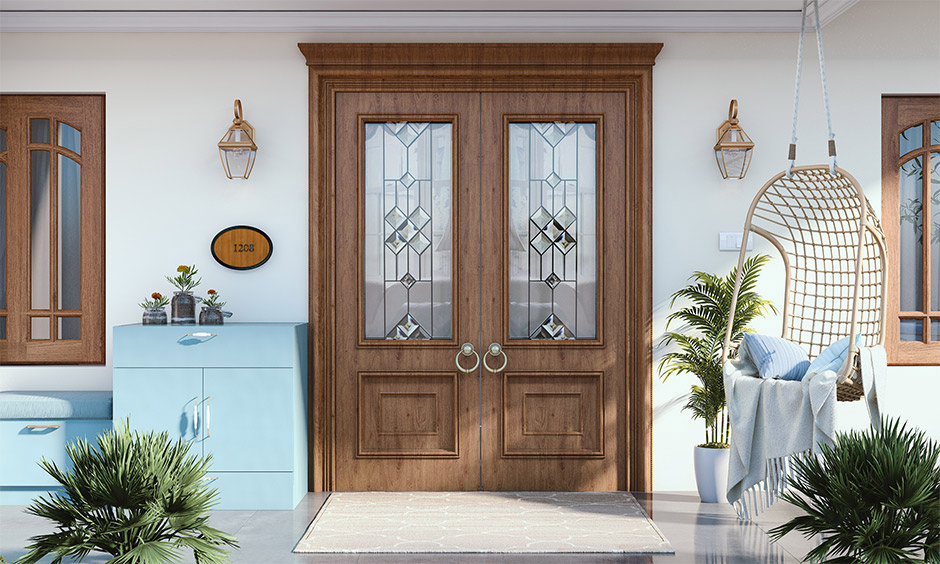 French-inspired wooden main double door design with glass panels and black metal hardware