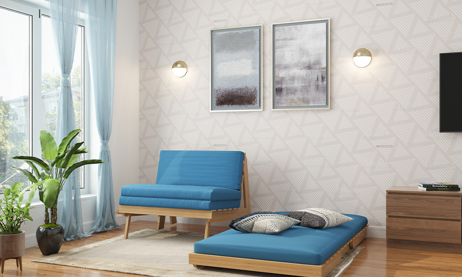 Single folding bed in blue doubles as a sofa